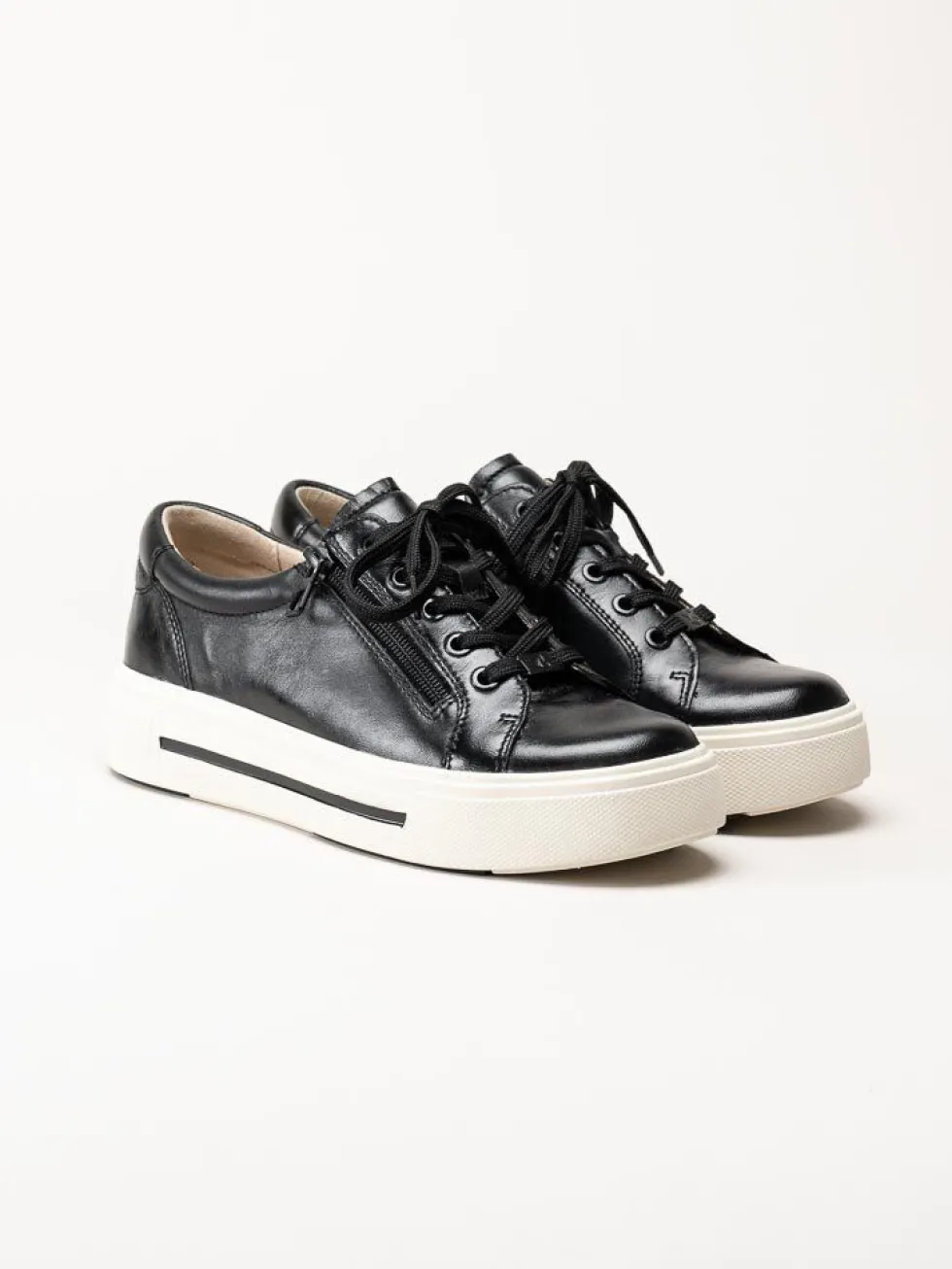 Caprice - Svarta platåsneakers i skinn