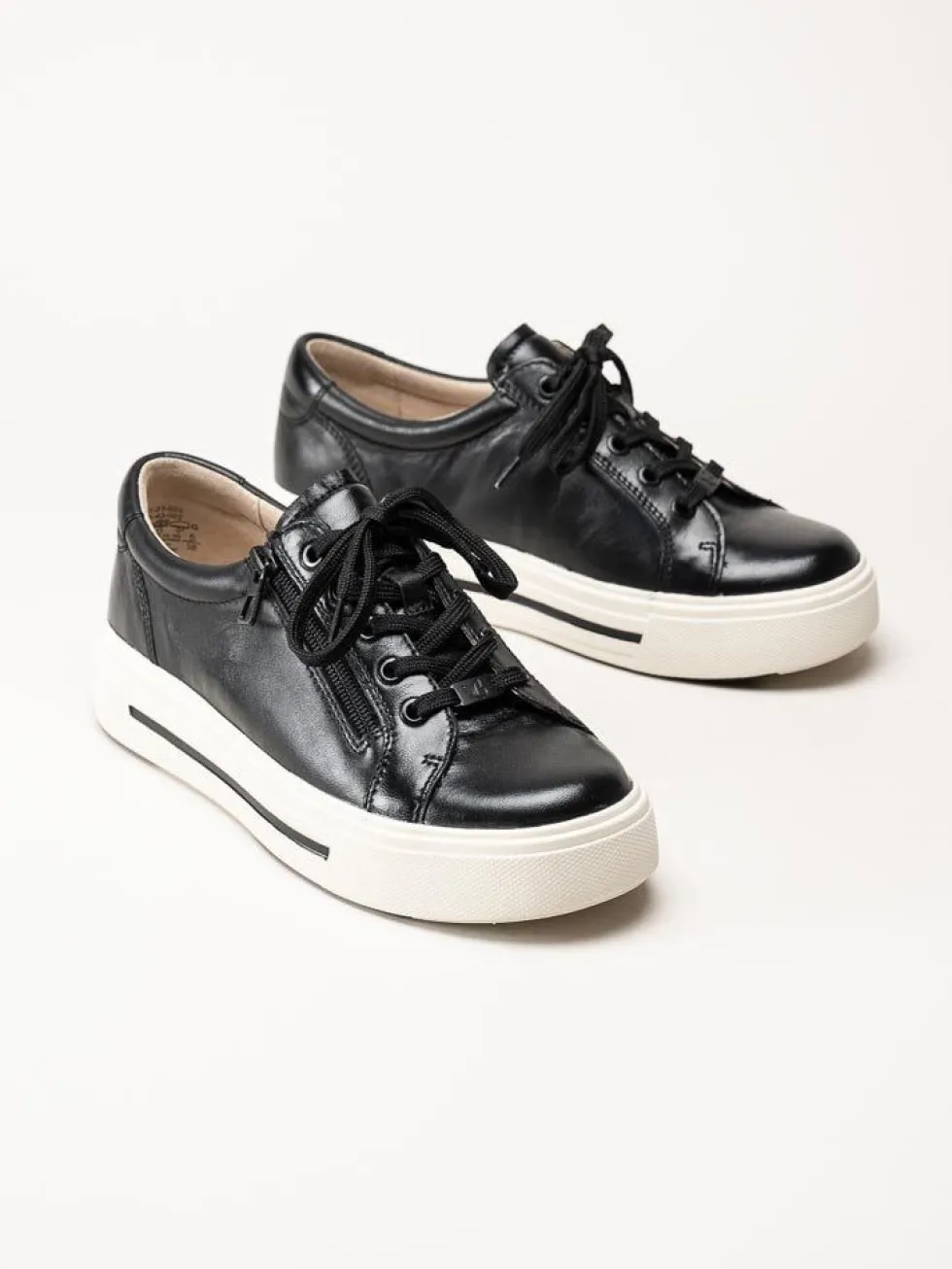 Caprice - Svarta platåsneakers i skinn