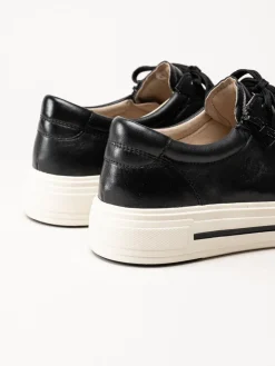 Caprice - Svarta platåsneakers i skinn