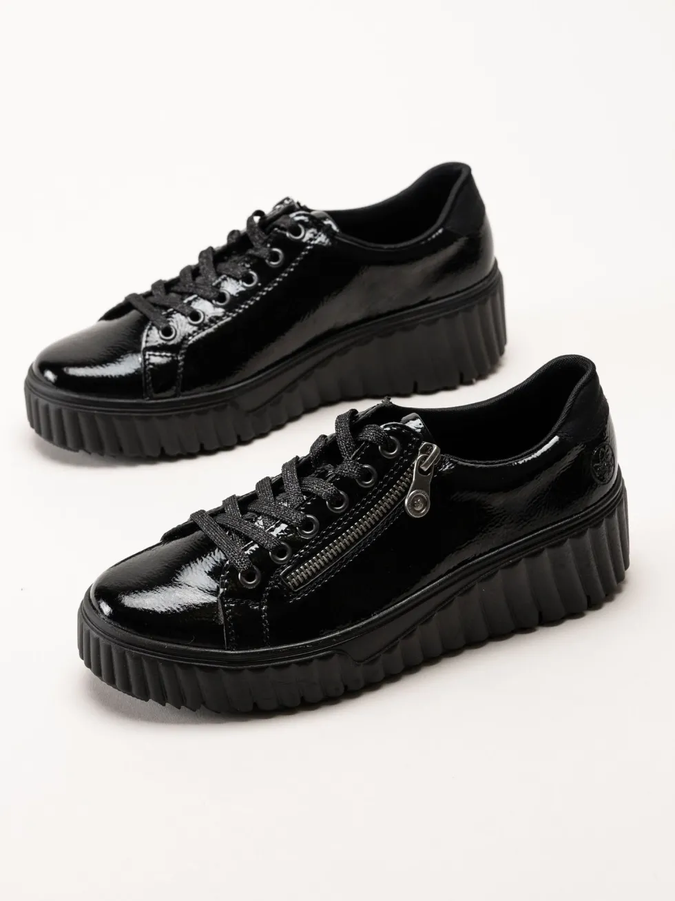 Rieker - Svarta platåsneakers i skinn-lack